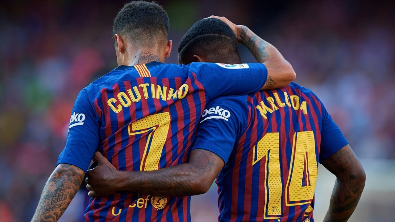 coutinho y malcom celebran un gol con el barcelona
